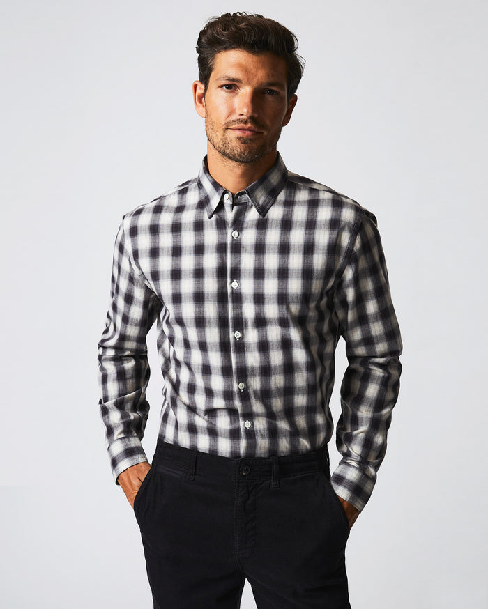 Male model wears the Shadow Plaid Tuscumbia Shirt Hidden Button Down in Black/Natural