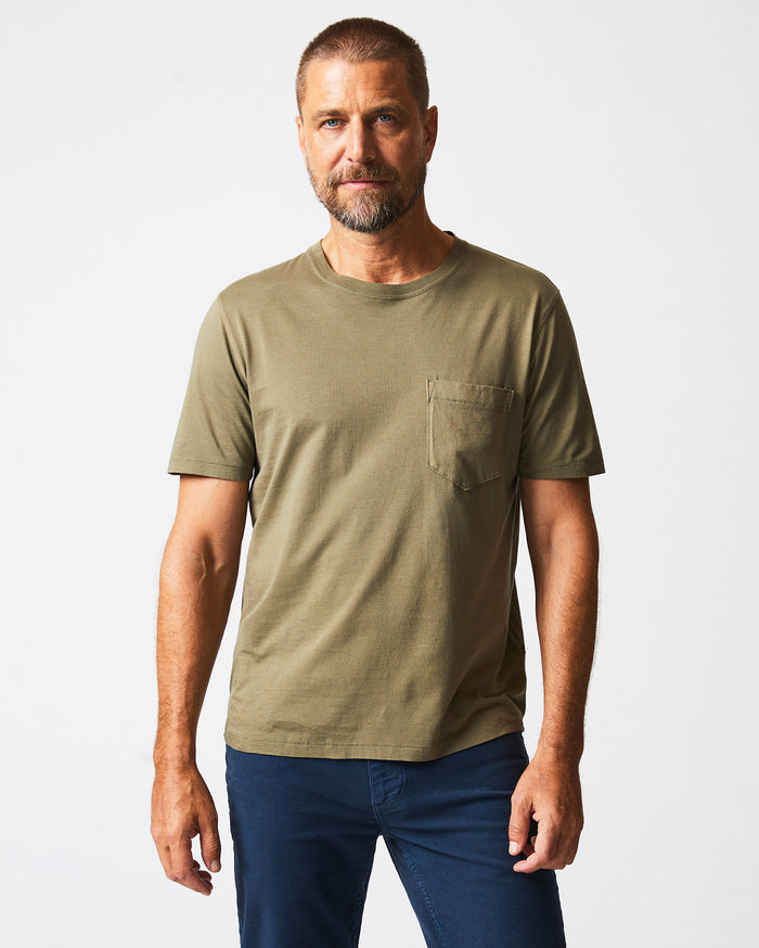 Male model wears the Washed Tee in Moss