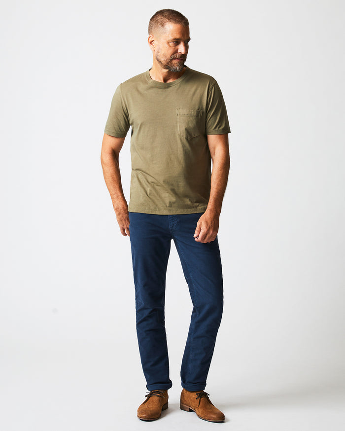 Male model wears the Washed Tee in Moss