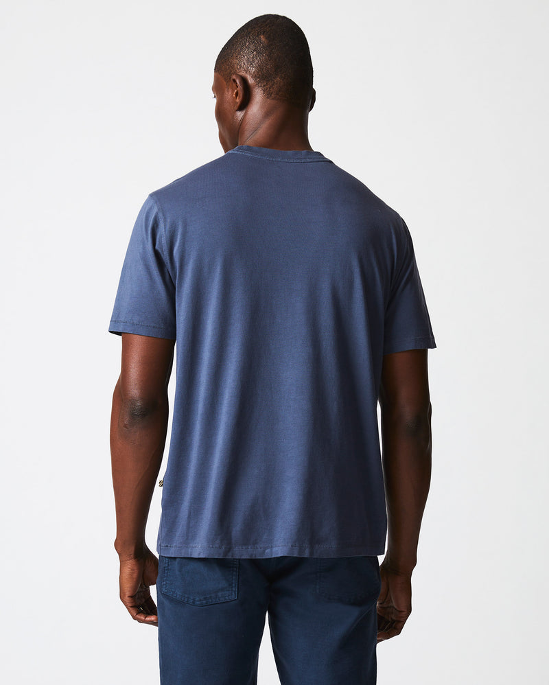 Male model wears the Washed Tee in Navy