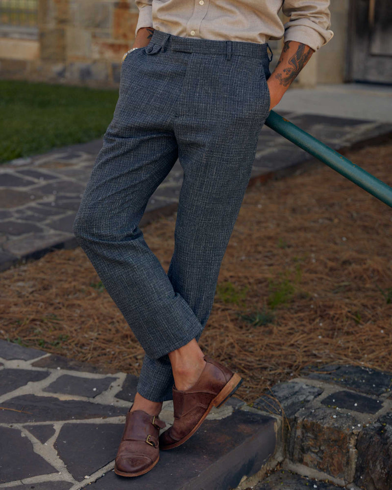 Male model wears the Flat Front Trouser in Charcoal