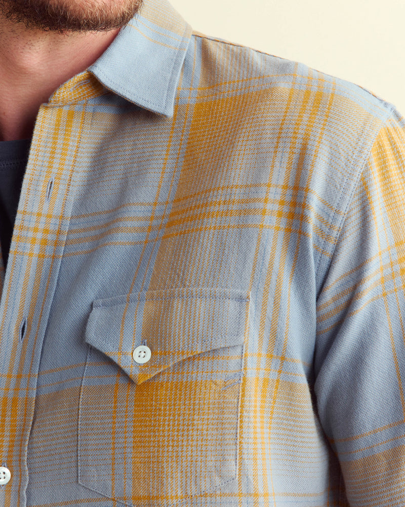 Male model wears the large scale plaid western shirt in faded denim